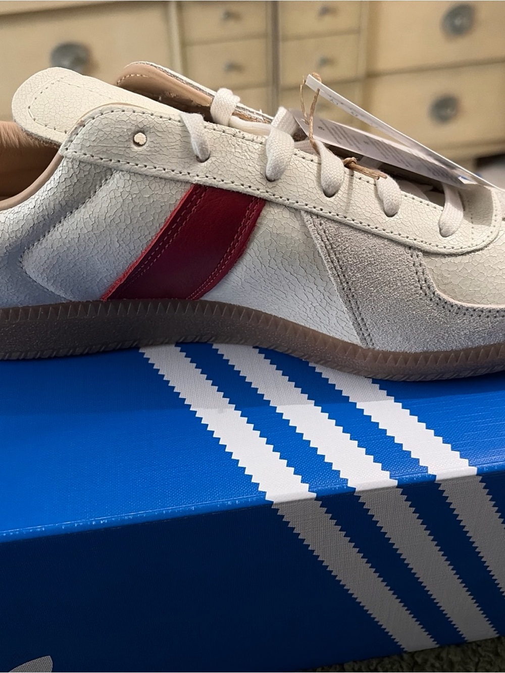 adidas Originals Cream Sneakers with Red Side Stripe